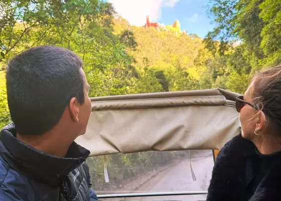 Guests looking towards Pena Palace from a YourTuk ride